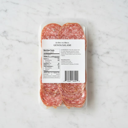 Packaged Genoa Salami with label on a dark background
