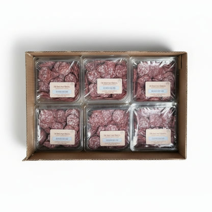 Box of packaged red meat with labels on a concrete floor