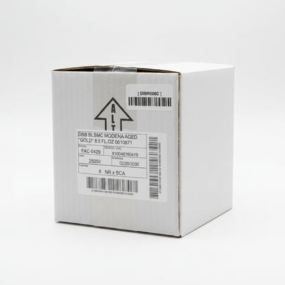 Cardboard box with labels and barcodes on a reflective surface