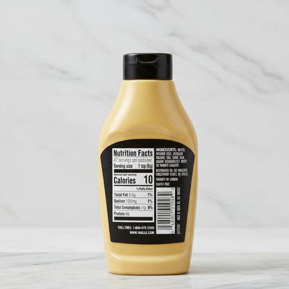 Mustard bottle with nutrition facts label on a white background
