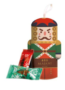 A Majani nutcracker-shaped chocolate gift box with candy packages placed in front on a plain white background.