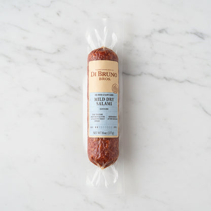 Packaged salami with Di Bruno Bros label on a dark surface