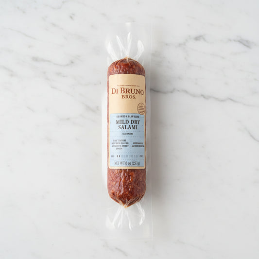 Packaged salami with Di Bruno Bros label on a dark surface