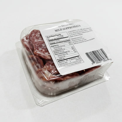 Packaged mild sopressata with a label on a white surface
