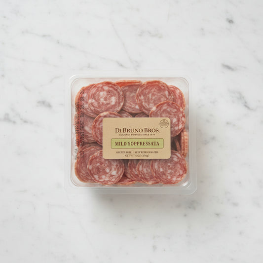Packaged mild soppressata with Di Bruno Bros label on a black background