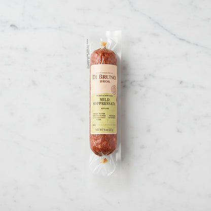 Packaged mild sopressata with Di Bruno Bros label on a dark surface
