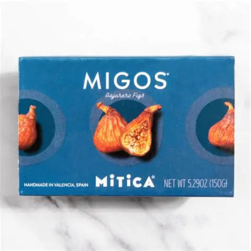Box of MIGOS figs from Mitica on a white marble background