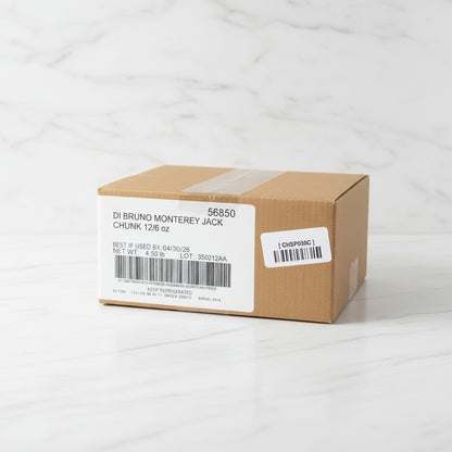 Cardboard box with 'Di Bruno Monterey Jack' label on a metal surface