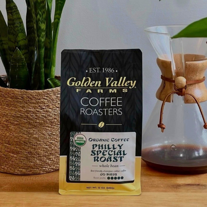 Fightin' Fanatic Roast Organic Coffee, 12-Ounce Bag with black packaging, displayed on a marble surface.