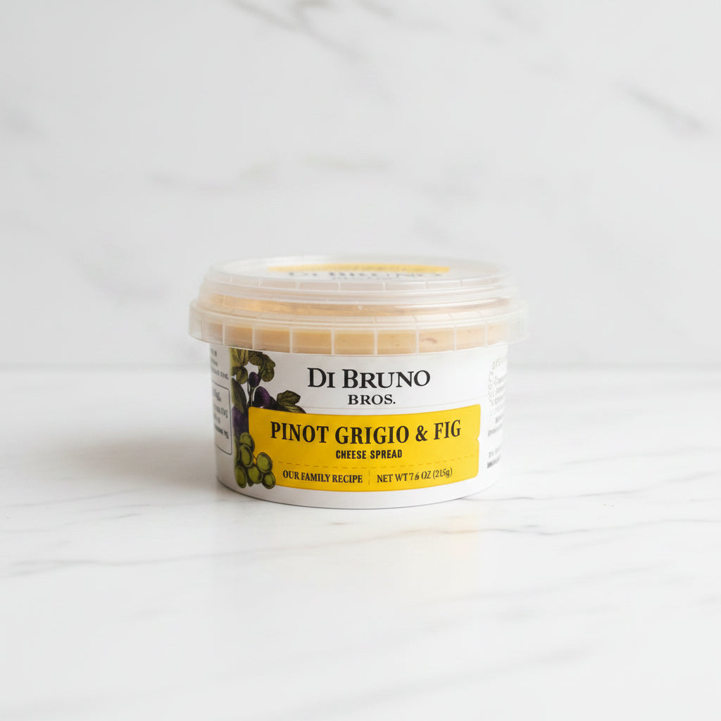 Container of Di Bruno Bros. Pinot Grigio & Fig cheese spread on a dark surface with a white background.