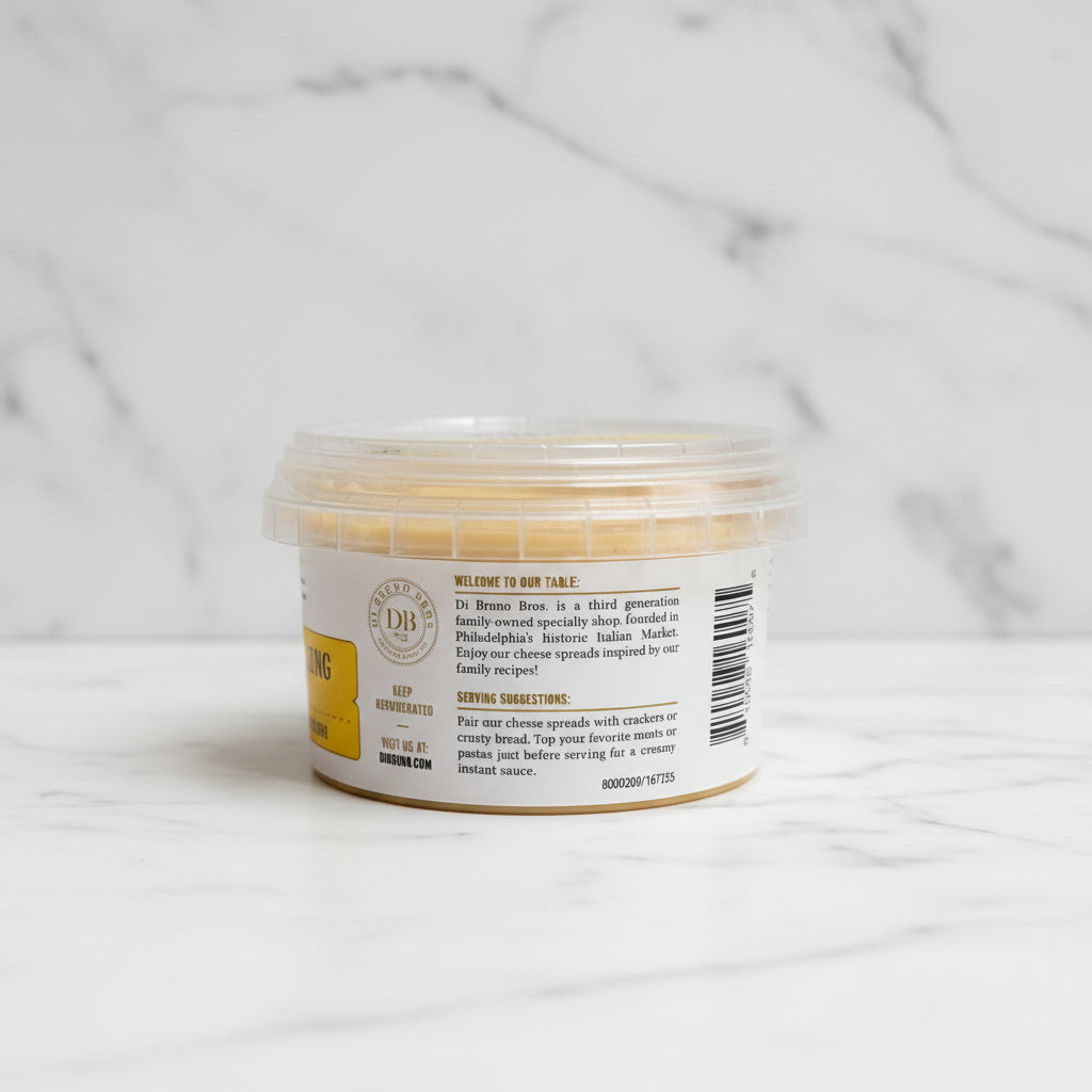 Container of food with a label on a black surface