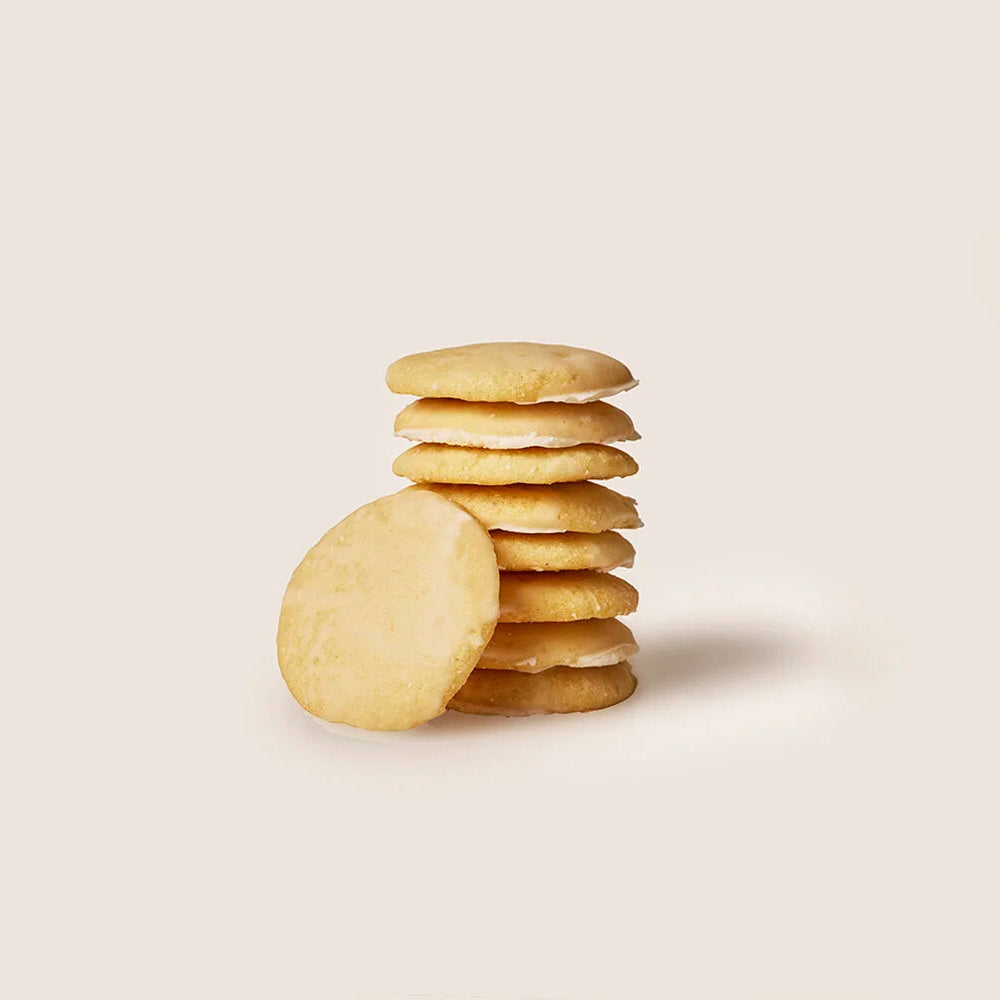 Stack of round cookies on a light beige background