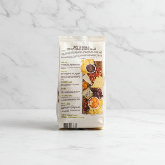 Package of Di Bruno Bros. Cheese Board with images and text on a dark surface