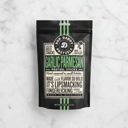 Garlic Parmesan pretzel sticks packaging with branding and text on a black background