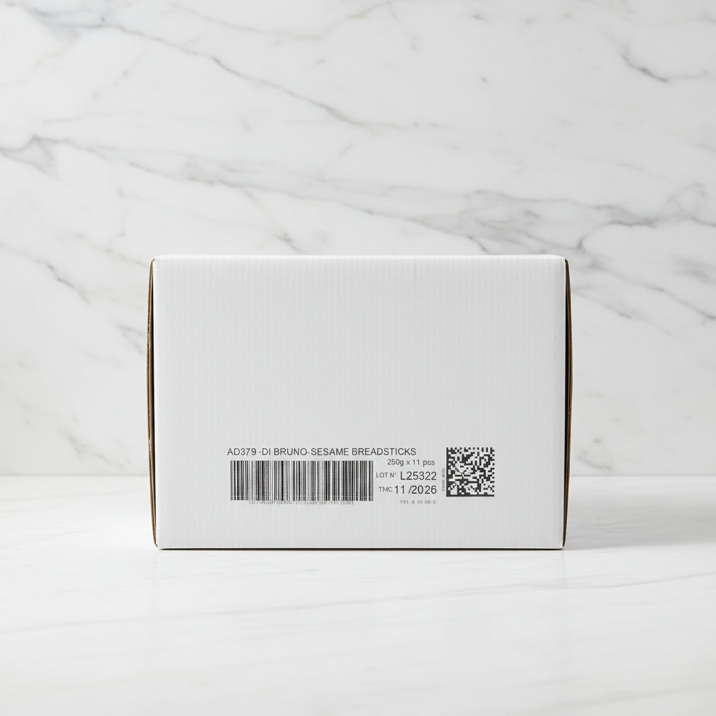 Close-up of a box with a label and barcode, set against an industrial background.