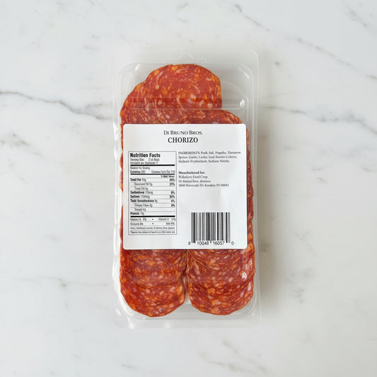 Packaged chorizo on a marble surface