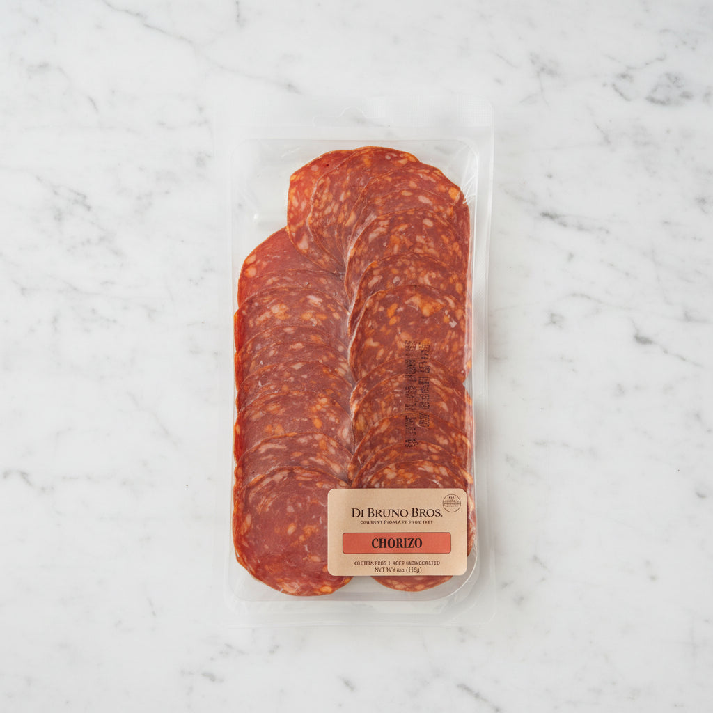Packaged chorizo sausage from Di Bruno Bros on a dark surface