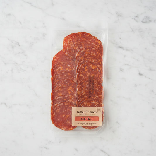 Packaged chorizo sausage from Di Bruno Bros on a dark surface