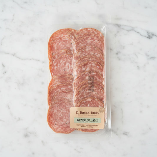 Packaged Genoa Salami from Di Bruno Bros on a dark background