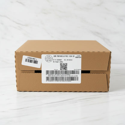 Cardboard box with labels on a concrete floor