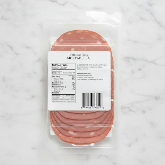 Packaged mortadella with a label on a gray background