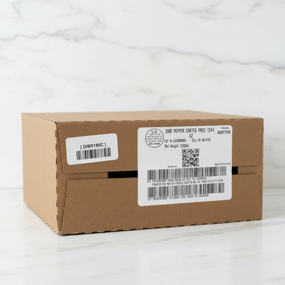 Cardboard box with labels and barcodes in a warehouse setting