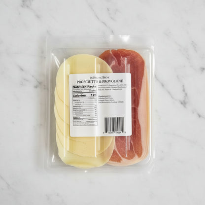 Packaged prosciutto and provolone cheese with a label on a black background