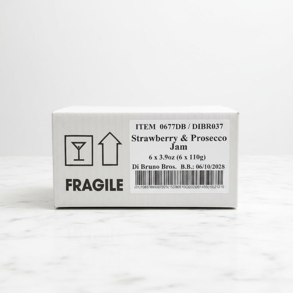 Box of Strawberry & Prosecco Jam with fragile label on a black surface
