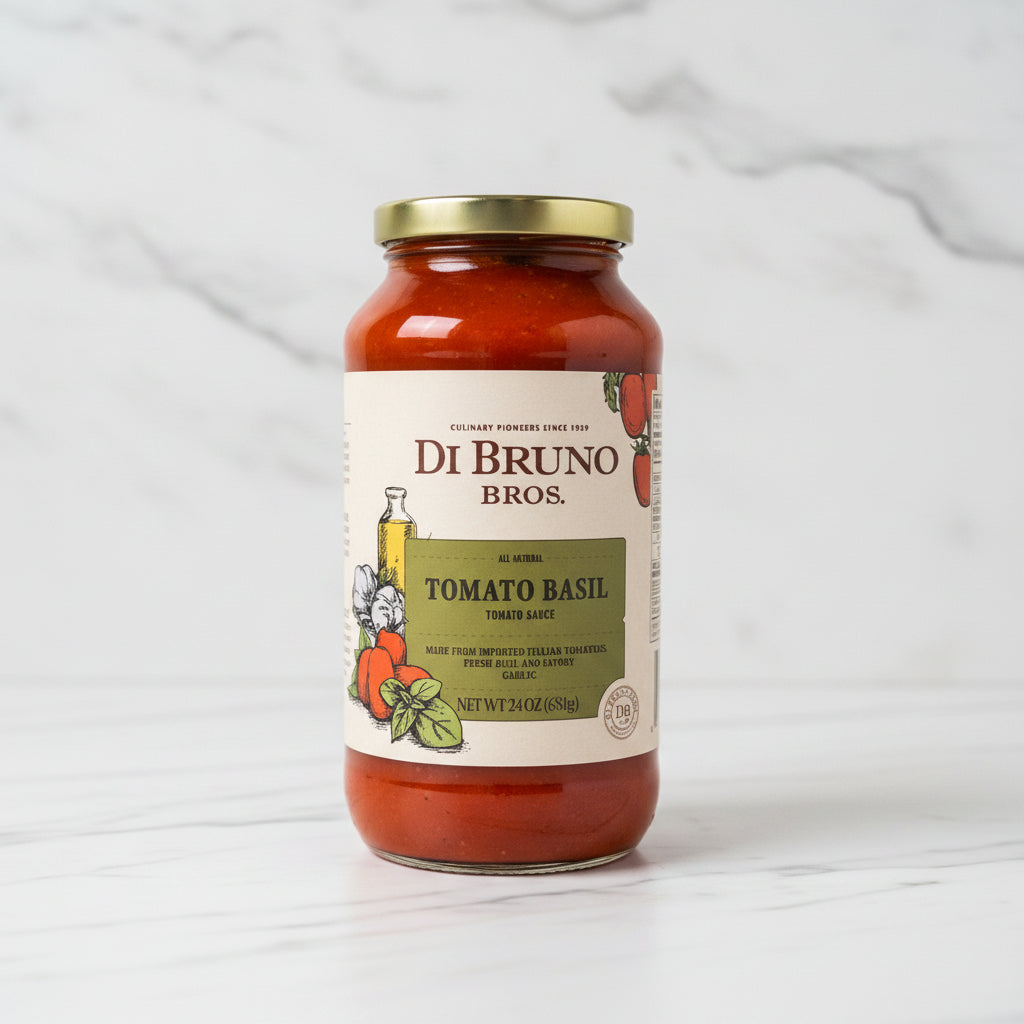 Jar of Di Bruno Bros Tomato Basil sauce on a black surface with a white background