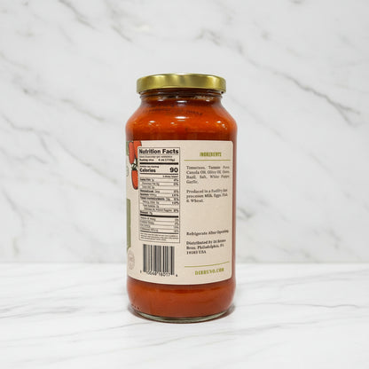 Jar of pasta sauce with label on a white background