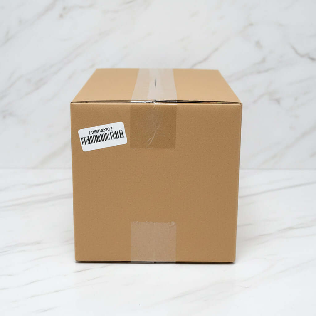 Premium tomato basil pasta sauce in a sealed cardboard box with shipping label.