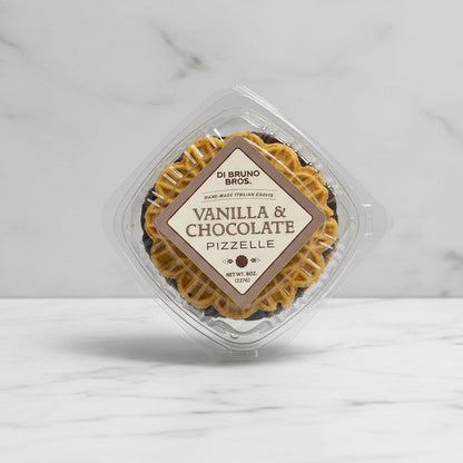 Packaged vanilla and chocolate pizzelle on a gray background