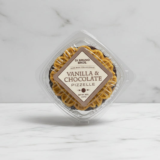 Packaged vanilla and chocolate pizzelle on a gray background
