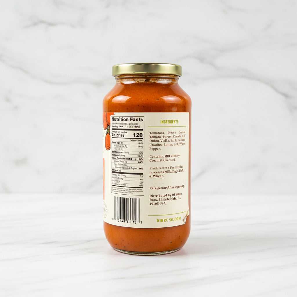 Jar of pasta sauce with label on a dark surface