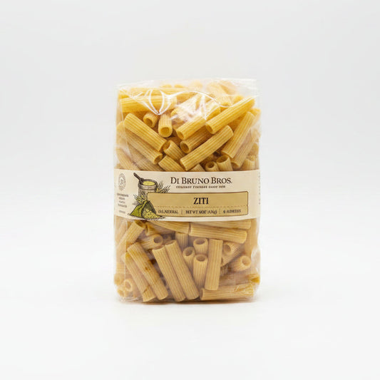 Packaged ziti pasta with Di Bruno Bros label on a black surface.