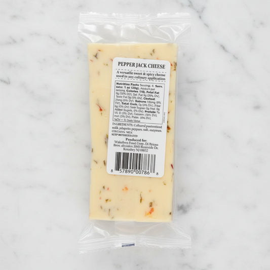 Package of pepper jack cheese with a label on a white background